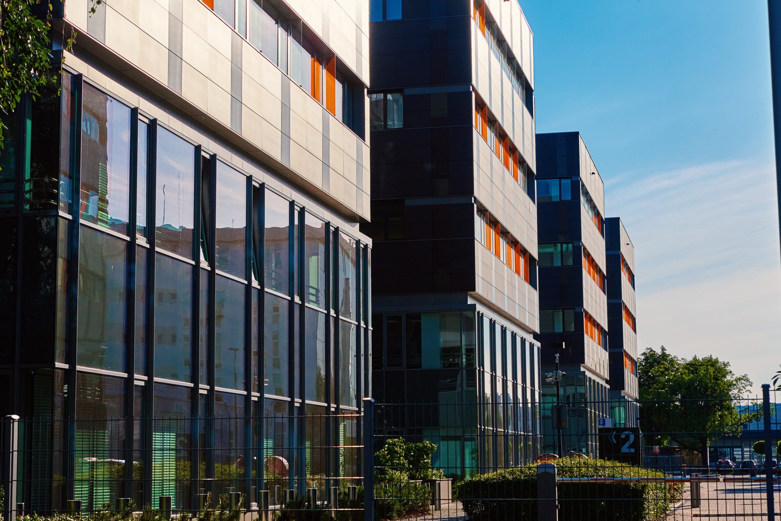 Facade of buiding with green trees, Modern office building in city for business corporation, Residential contemporary